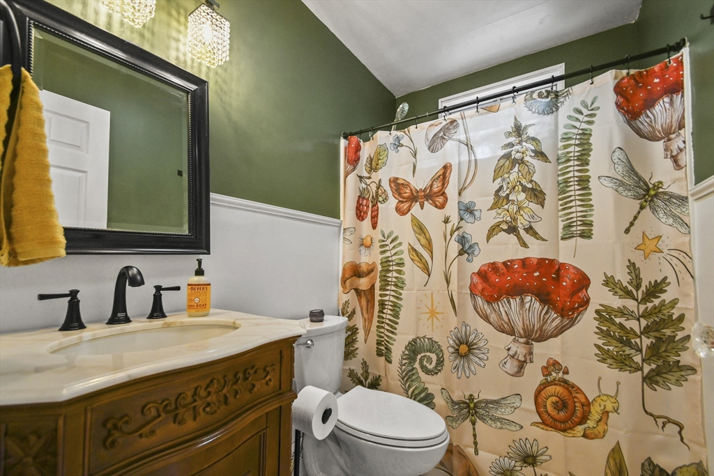29 Prescott Street Rutland, MA 01543 - Photo 23 of 30 a bathroom with a granite countertop sink mirror vanity and toilet