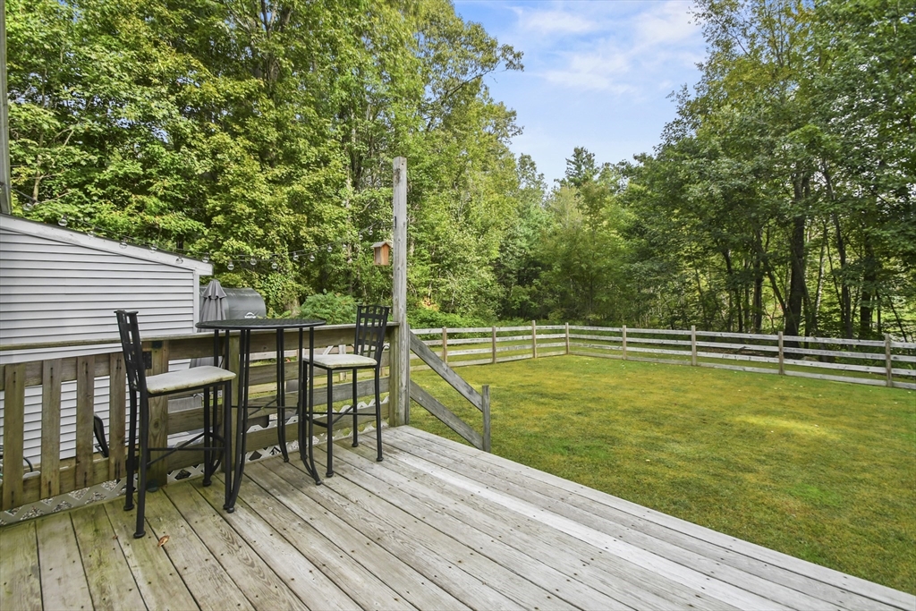 29 Prescott Street Rutland, MA 01543 - Photo 24 of 30 a view of a balcony with chairs and wooden floor