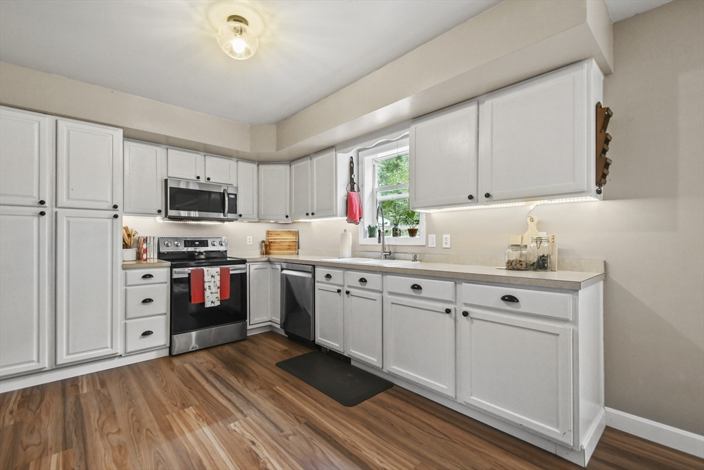 29 Prescott Street Rutland, MA 01543 - Photo 9 of 30 a kitchen with granite countertop a refrigerator stove top oven and sink