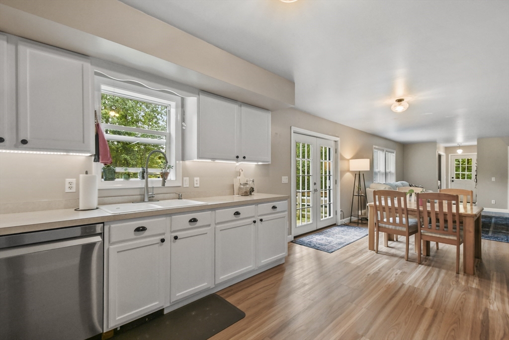 29 Prescott Street Rutland, MA 01543 - Photo 10 of 30 a kitchen with a sink chairs and wooden floor