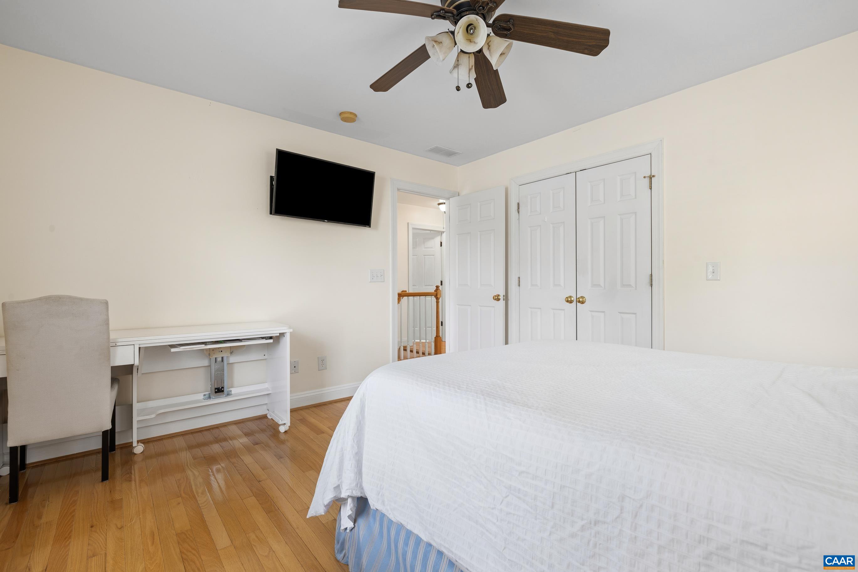 1236 Amber Ridge Road Charlottesville, VA 22901 - Photo 25 of 56 a bedroom with a bed and a flat screen tv