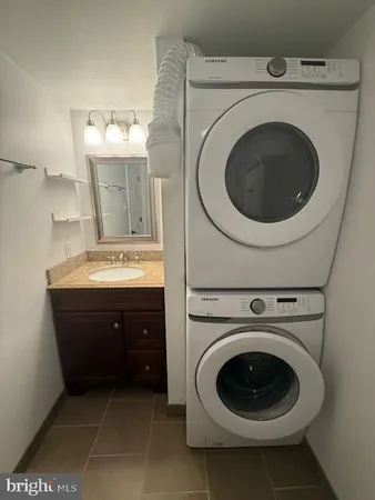 a spacious bathroom with a sink and a mirror