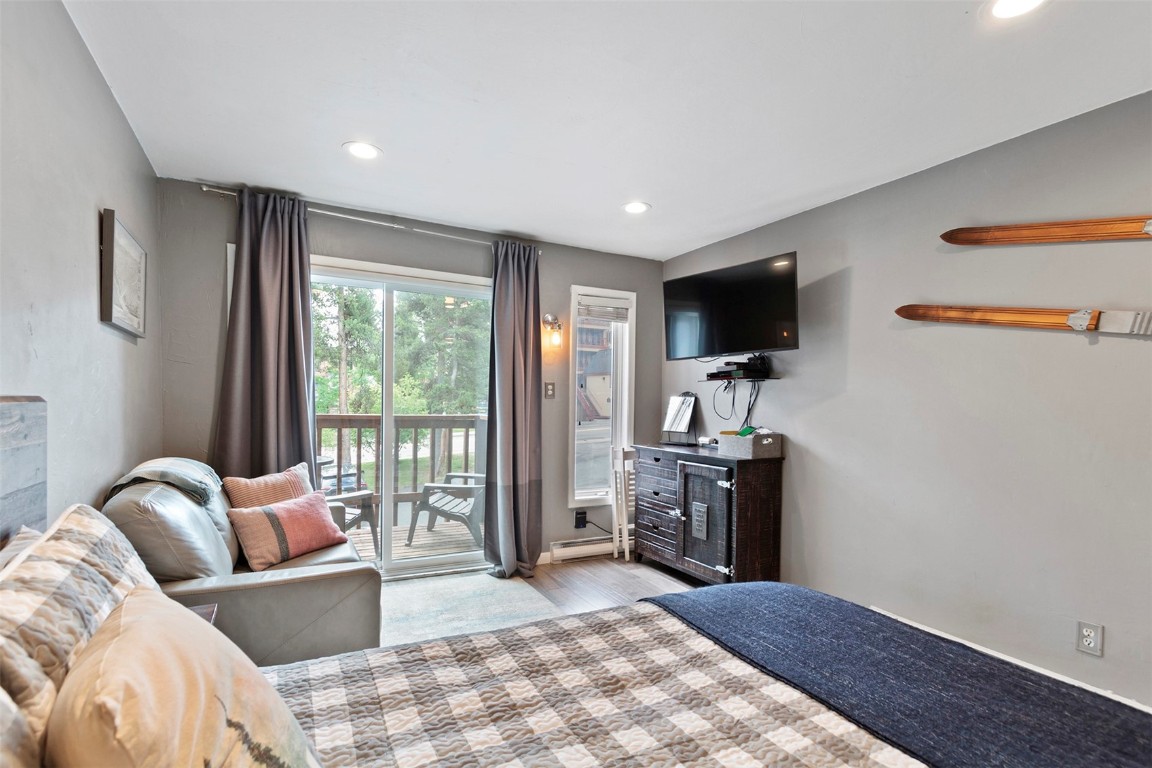 550 4 O Clock Road, Unit 3 Breckenridge, CO 80424 - Photo 8 of 25 a living room with furniture and a flat screen tv