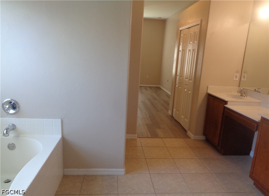 2463 Nature Pointe Loop Fort Myers, FL 33905 - Photo 28 of 50 a bathroom with a bathtub sink and vanity