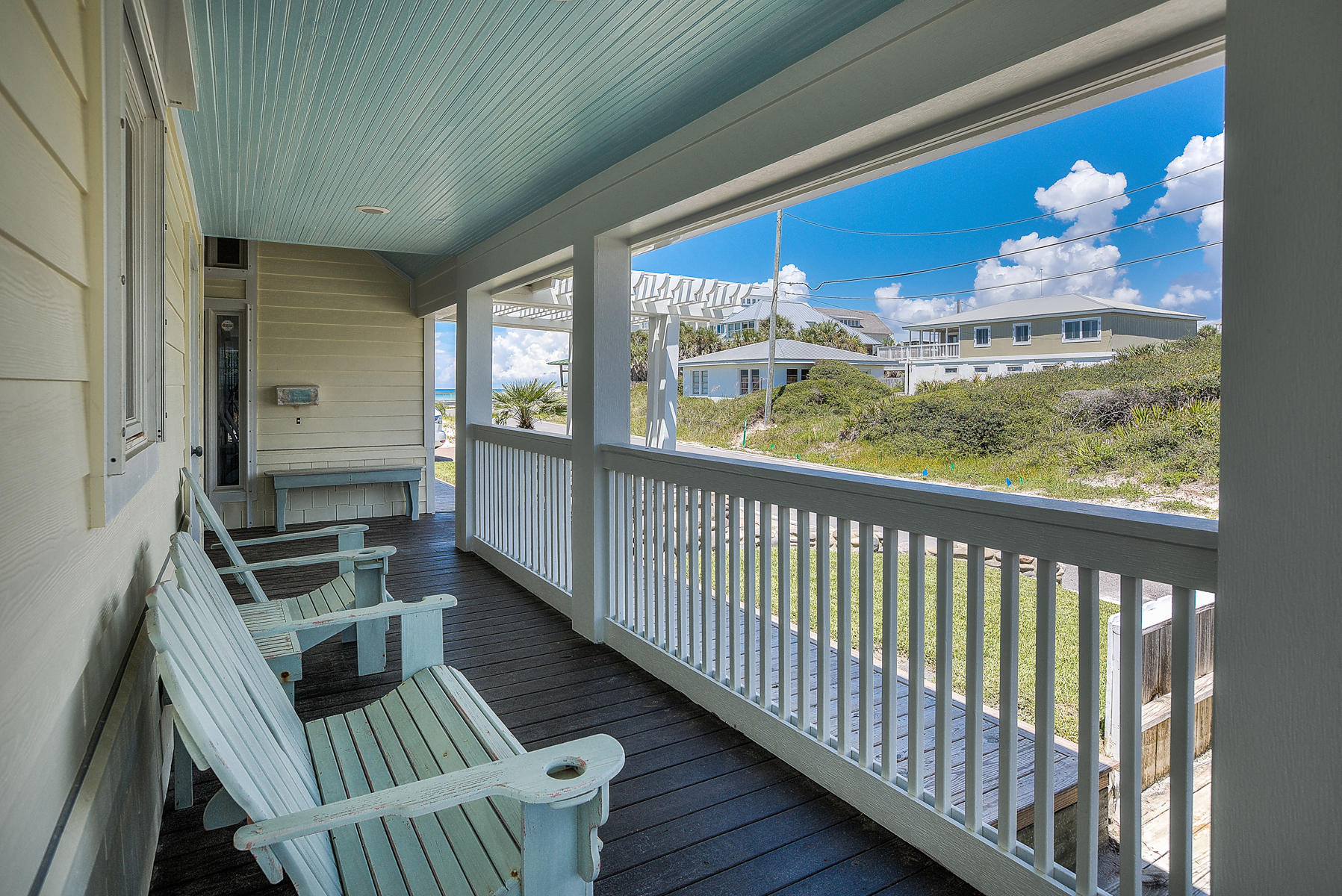 325 Pompano Street Inlet Beach, FL 32461 - Photo 15 of 49 a view of a balcony with furniture