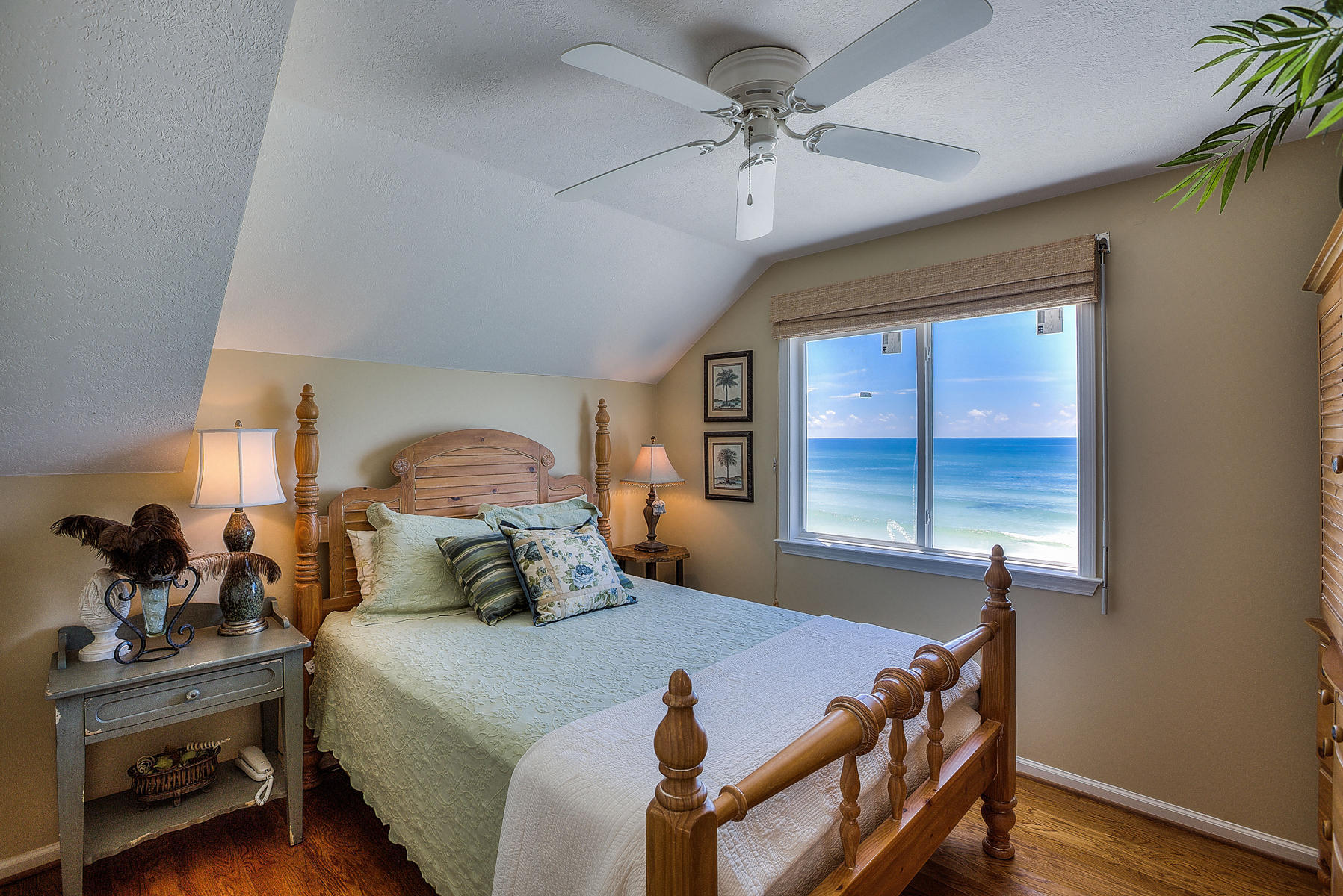 325 Pompano Street Inlet Beach, FL 32461 - Photo 32 of 49 a bedroom with a bed a window and a chandelier