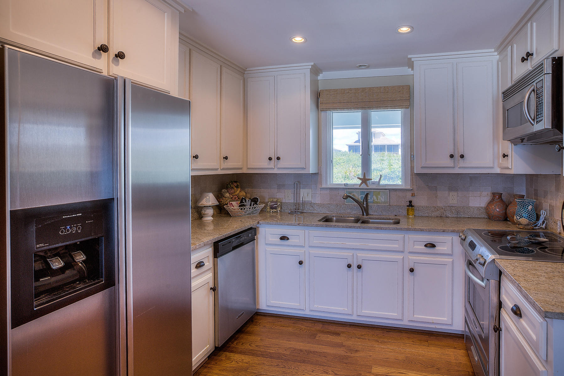 325 Pompano Street Inlet Beach, FL 32461 - Photo 10 of 49 a kitchen with a sink stove and cabinets