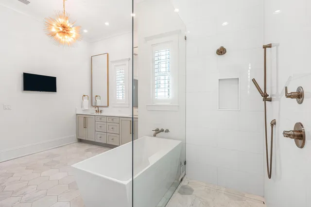 a large bathroom with a granite countertop sink a toilet and a shower
