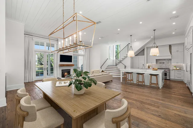 a living room with furniture a chandelier and a chandelier