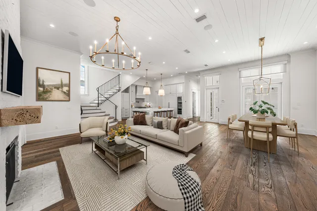 a spacious bathroom with a double vanity sink a large mirror and a bathtub