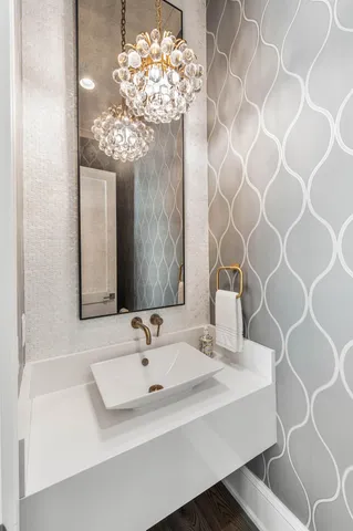 a bathroom with a double vanity sink and mirror