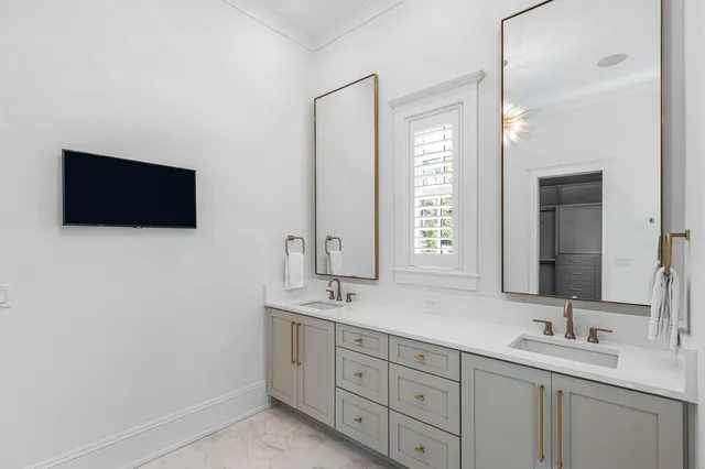a utility room with sink dryer and washer