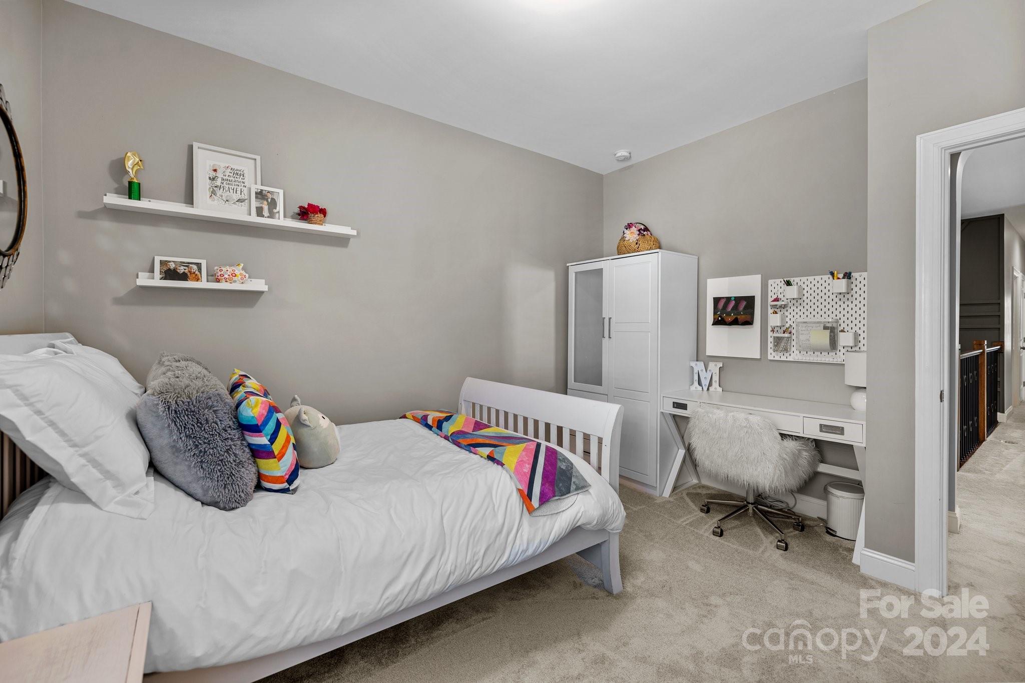470 Langston Pl Drive Fort Mill, SC 29708 - Photo 19 of 40 a bedroom with a bed and a refrigerator