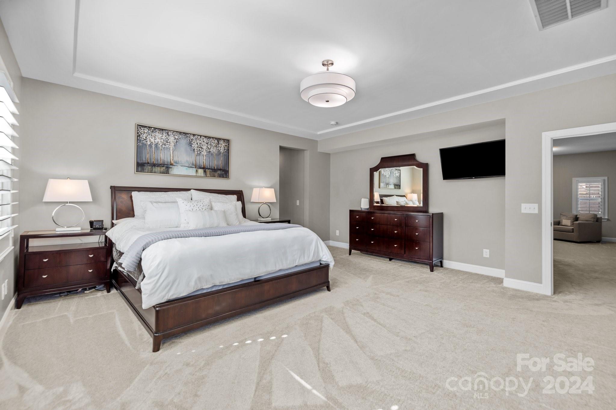 470 Langston Pl Drive Fort Mill, SC 29708 - Photo 22 of 40 a spacious bedroom with a bed and window