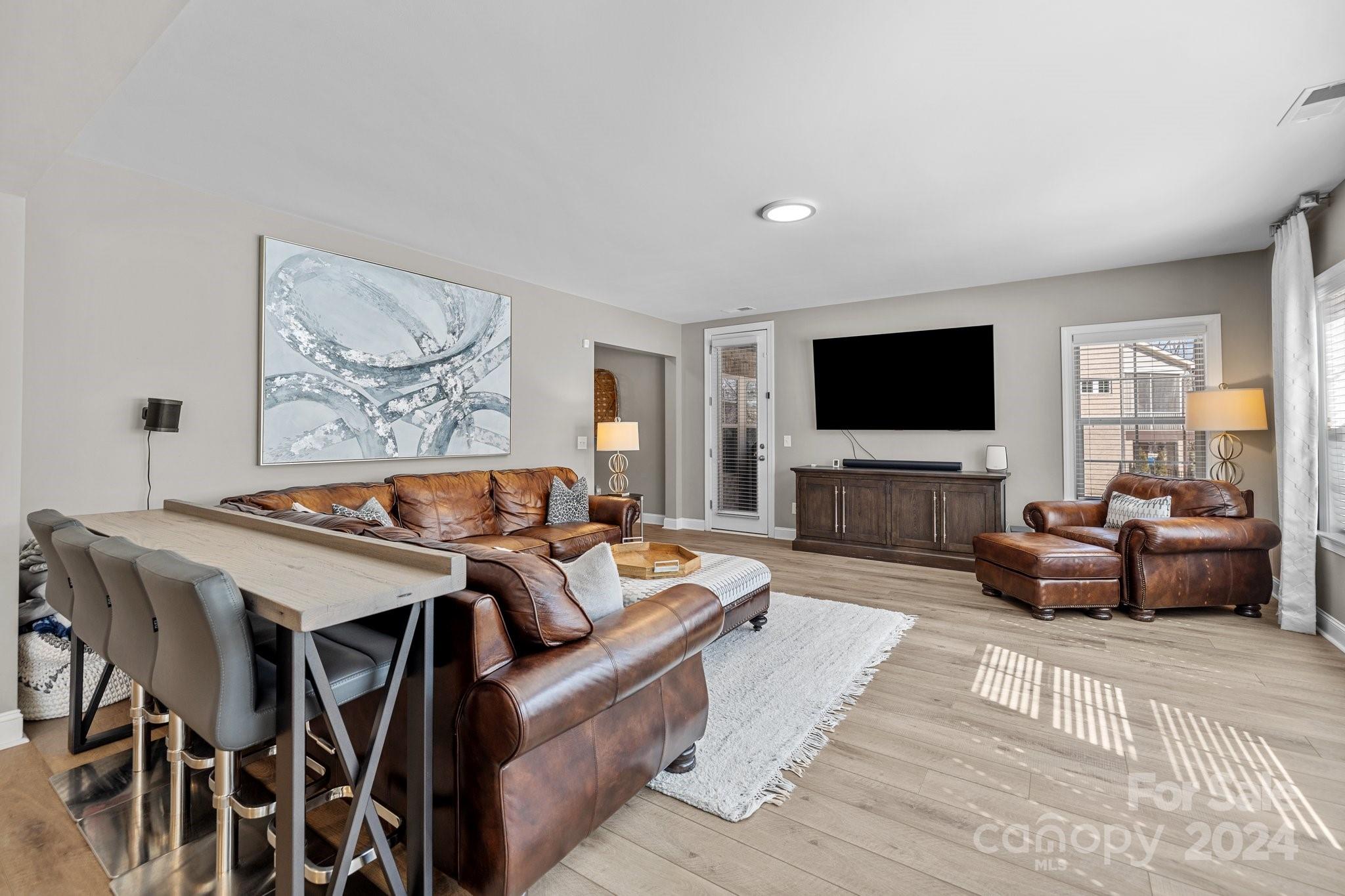 470 Langston Pl Drive Fort Mill, SC 29708 - Photo 29 of 40 a living room with furniture and a flat screen tv