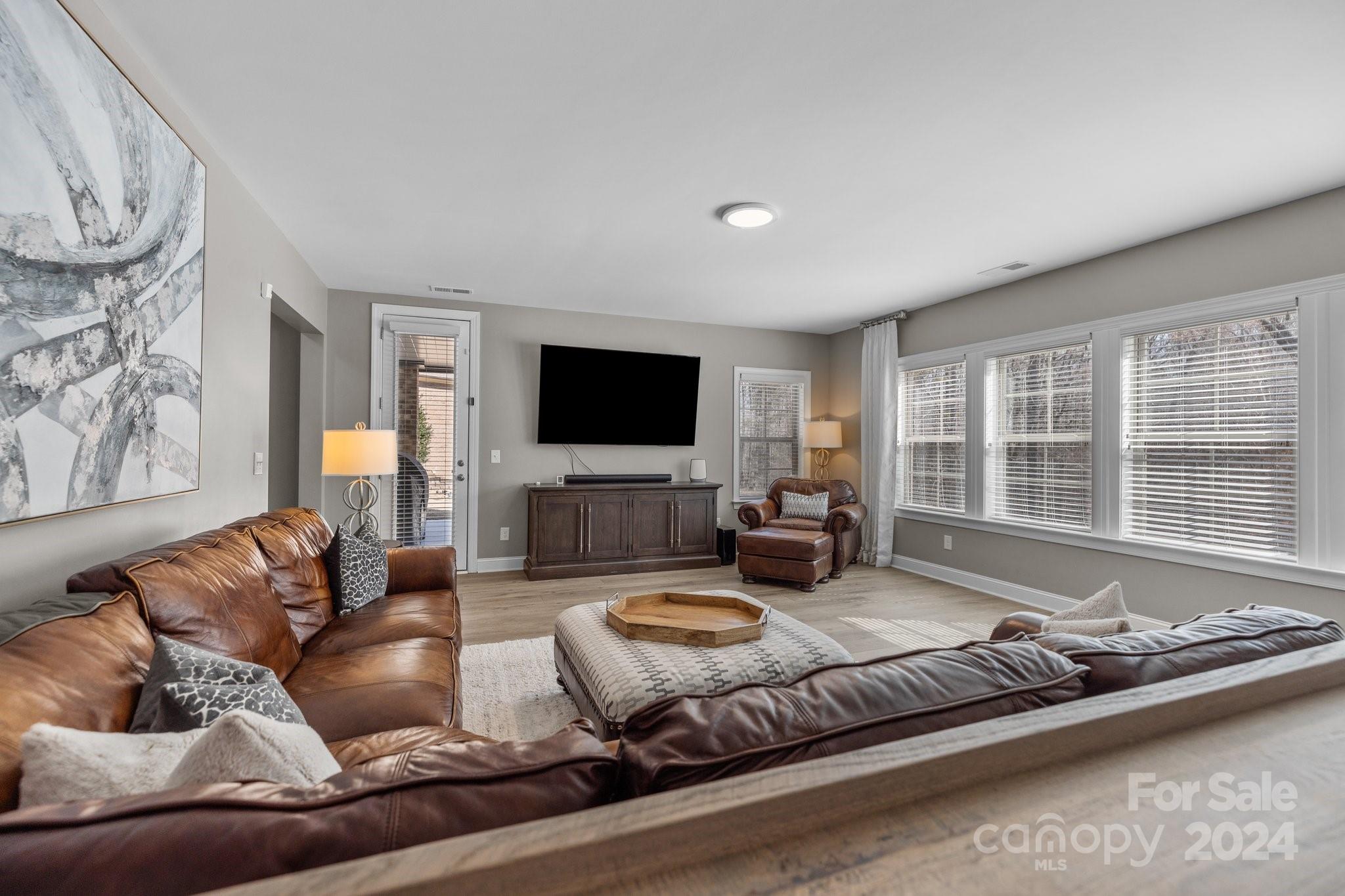 470 Langston Pl Drive Fort Mill, SC 29708 - Photo 30 of 40 a living room with furniture and a flat screen tv