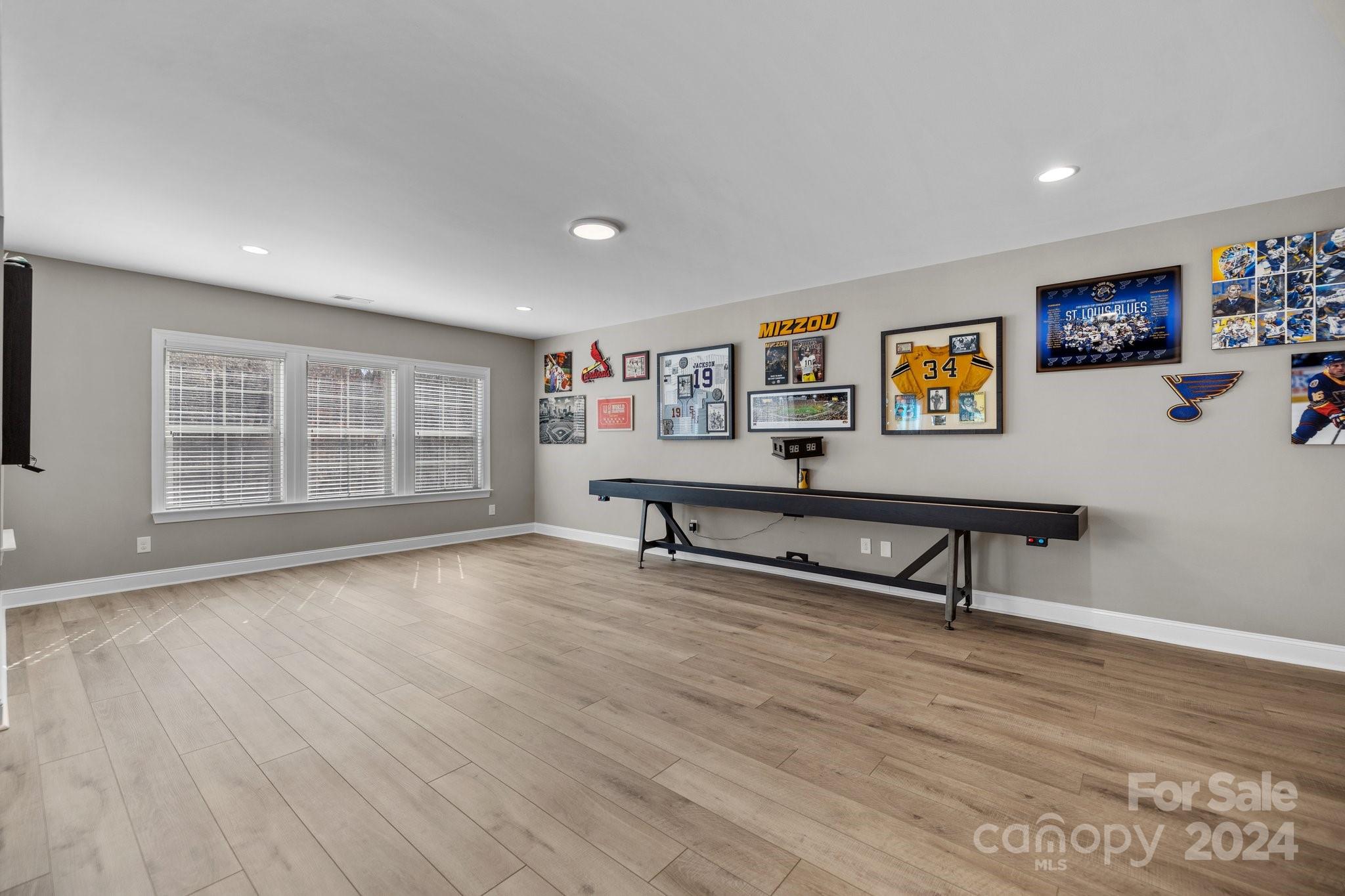 470 Langston Pl Drive Fort Mill, SC 29708 - Photo 31 of 40 a view of an empty room with window and wooden floor