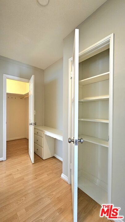 1022 South Norton Avenue, Unit C Los Angeles, CA 90019 - Photo 18 of 43 a view of a room with a wooden floor and window