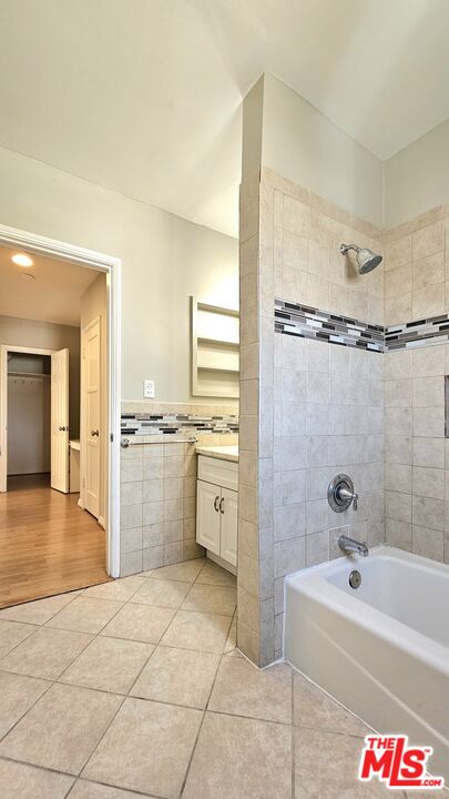 1022 South Norton Avenue, Unit C Los Angeles, CA 90019 - Photo 26 of 43 a bathroom with a sink a toilet and shower