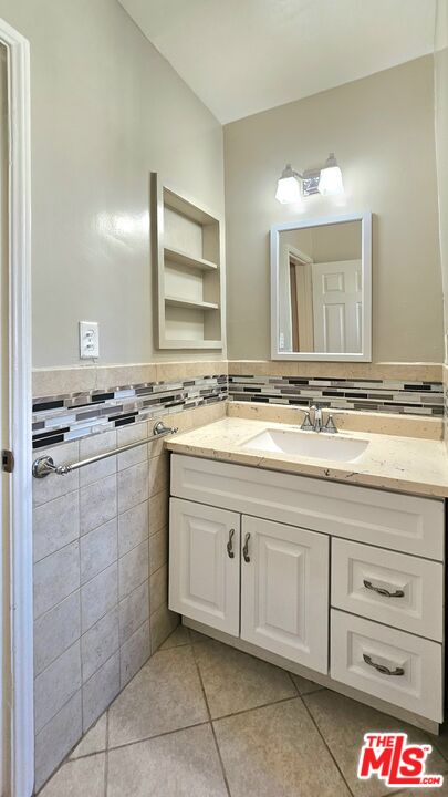 1022 South Norton Avenue, Unit C Los Angeles, CA 90019 - Photo 27 of 43 a kitchen with a sink and cabinets