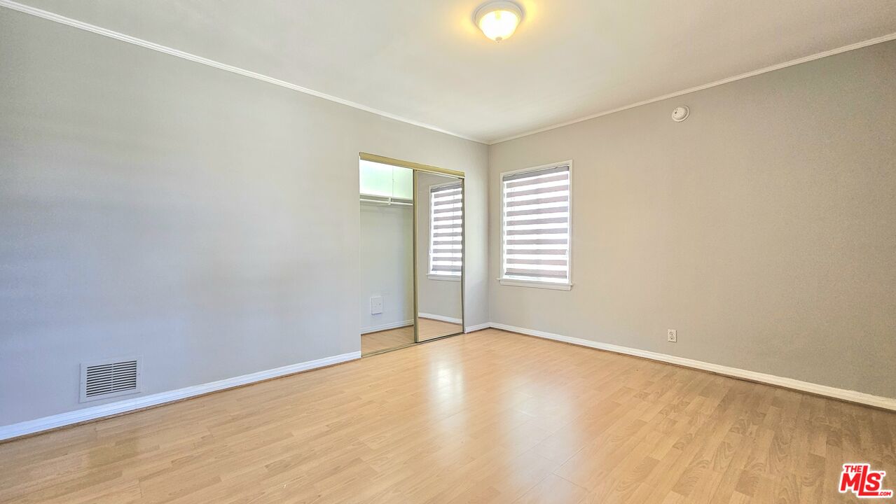 1022 South Norton Avenue, Unit C Los Angeles, CA 90019 - Photo 32 of 43 an empty room with windows