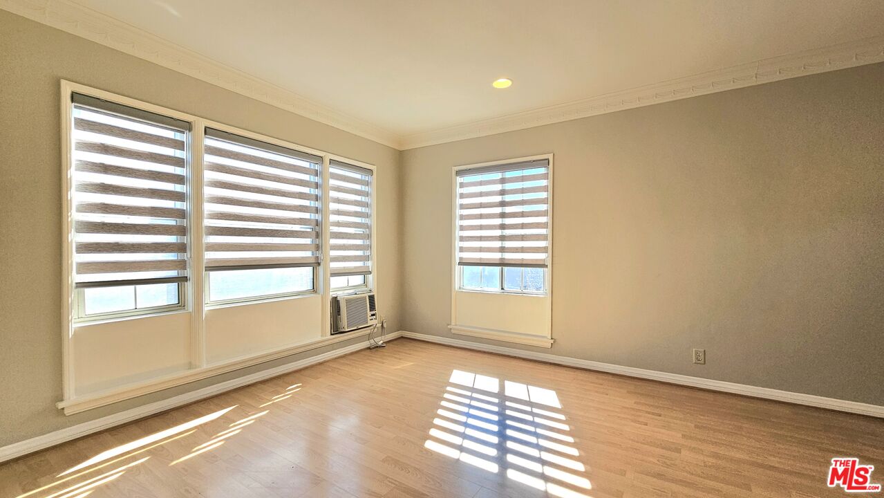 1022 South Norton Avenue, Unit C Los Angeles, CA 90019 - Photo 9 of 43 a view of an empty room with a window