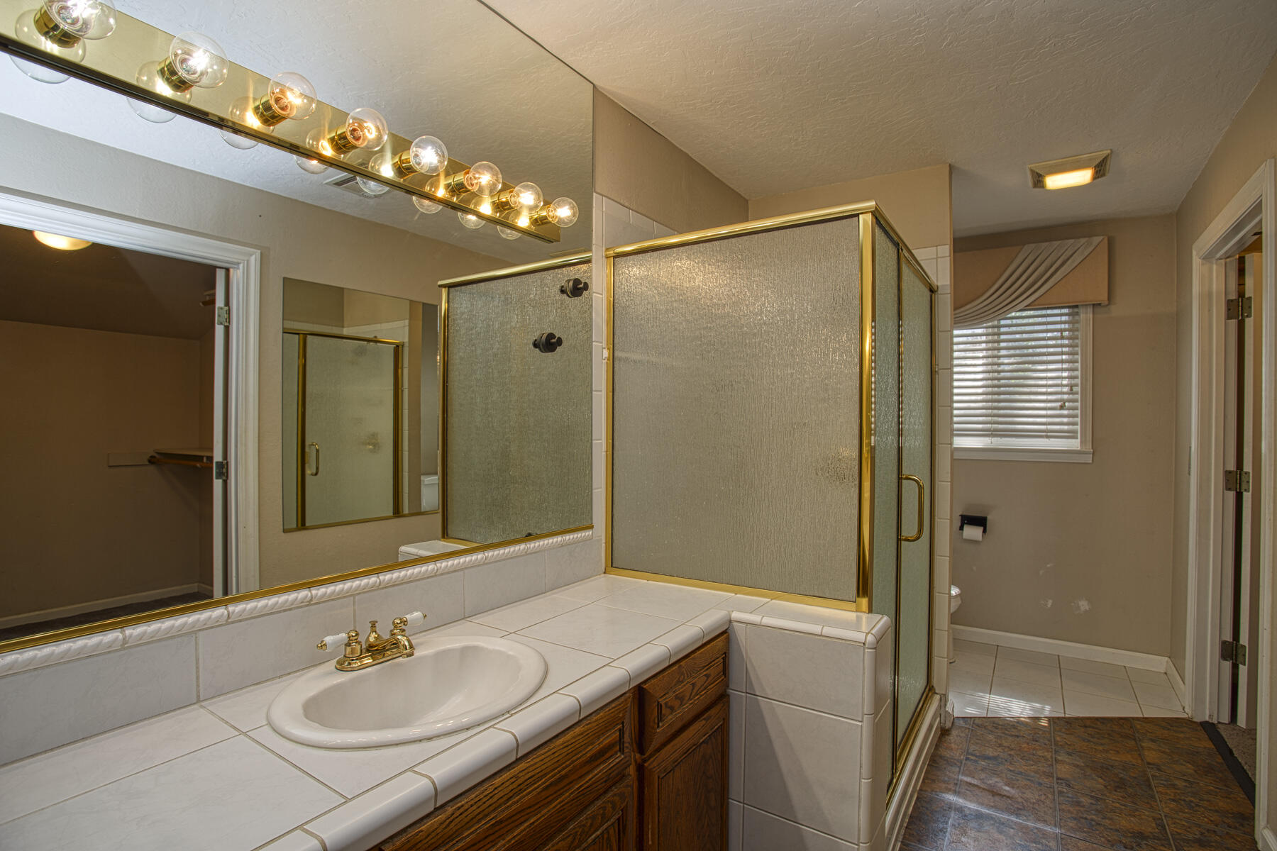 17829 Ranchera Road Shasta Lake, CA 96019 - Photo 18 of 39 a bathroom with a sink shower and a mirror
