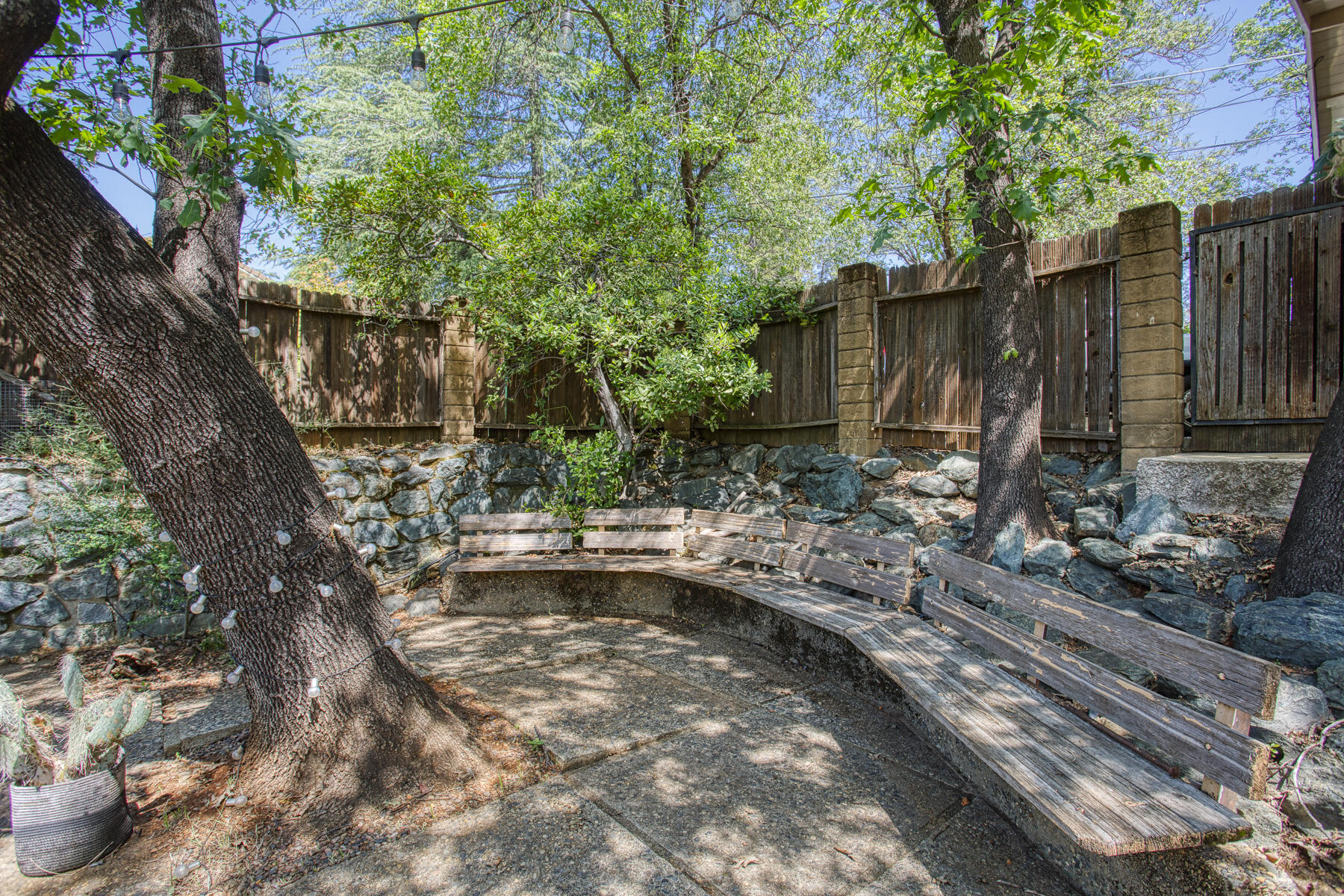 17829 Ranchera Road Shasta Lake, CA 96019 - Photo 27 of 39 a view of backyard with a table and chairs and potted plants