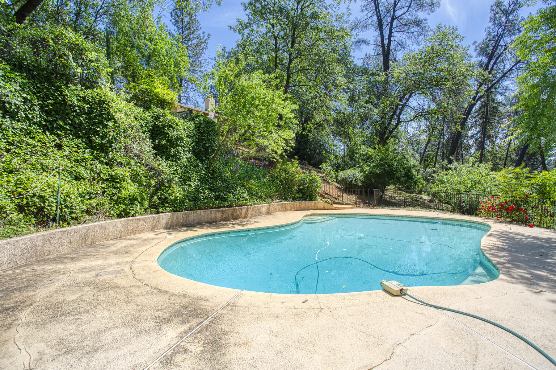 17829 Ranchera Road Shasta Lake, CA 96019 - Photo 4 of 39 a view of a swimming pool with an outdoor space