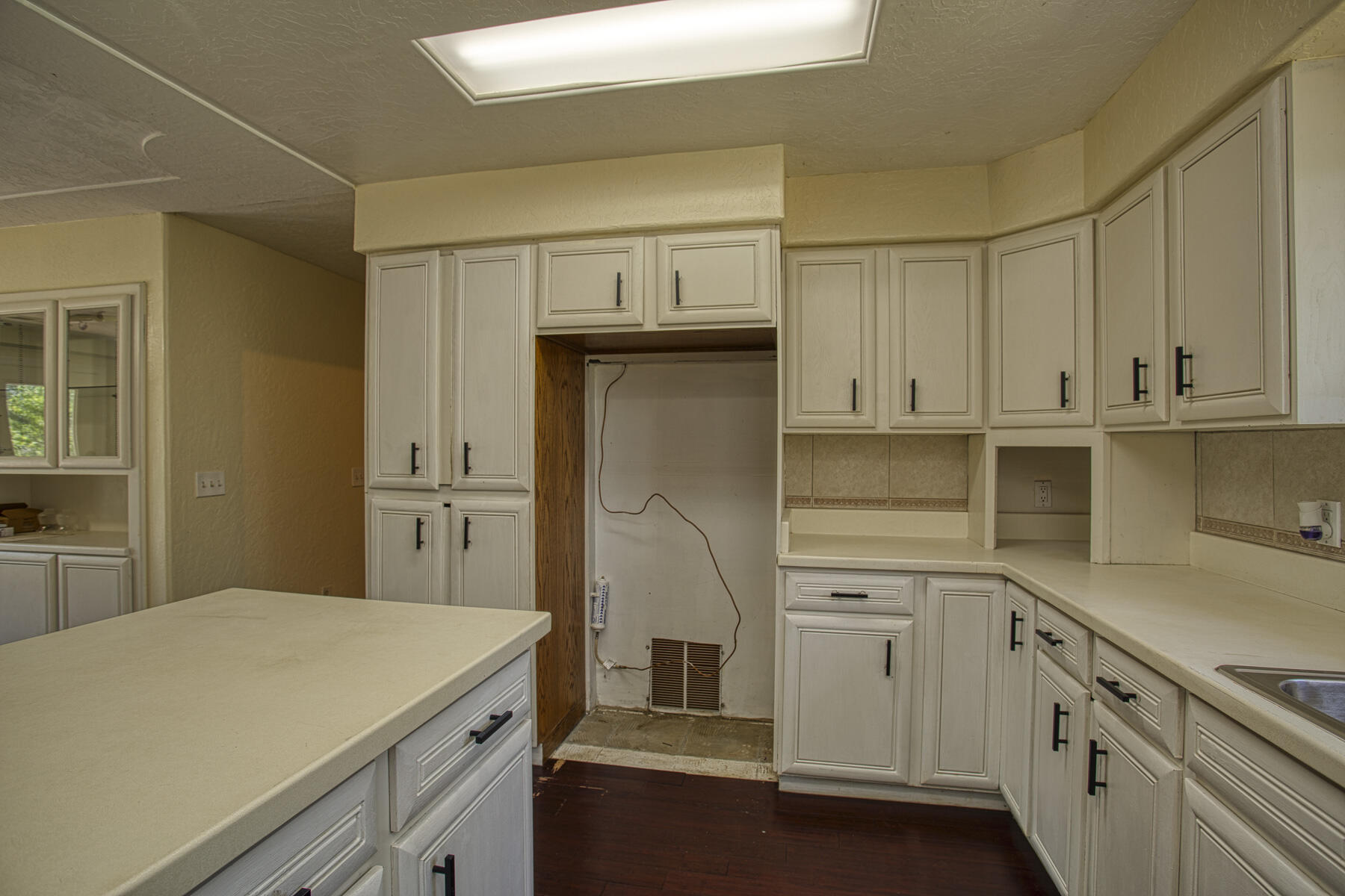 17829 Ranchera Road Shasta Lake, CA 96019 - Photo 7 of 39 a kitchen with white cabinets and white appliances