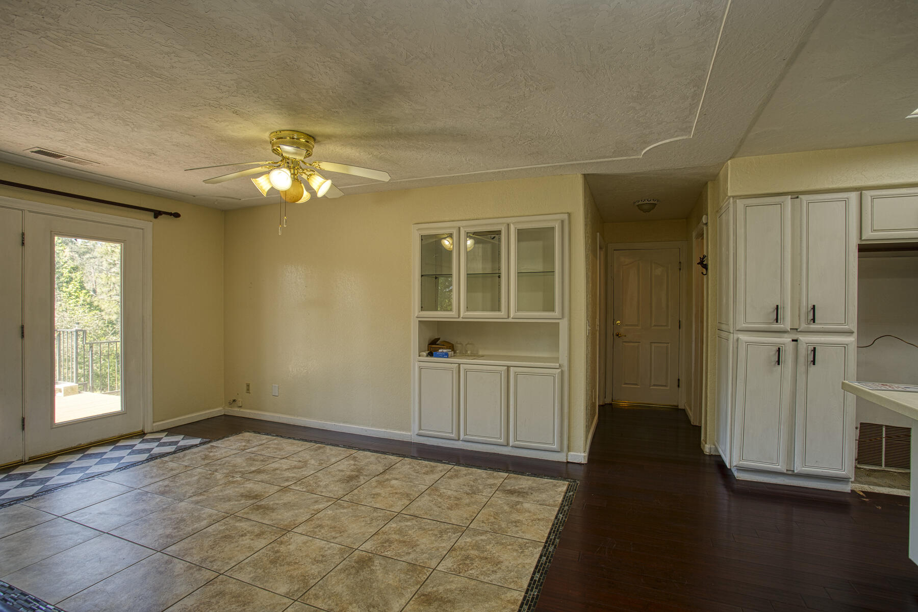 17829 Ranchera Road Shasta Lake, CA 96019 - Photo 8 of 39 wooden floor in an empty room with a window