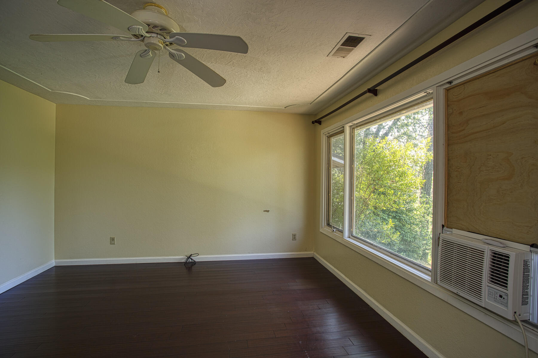 17829 Ranchera Road Shasta Lake, CA 96019 - Photo 10 of 39 a view of a room with wooden floor and iron walls