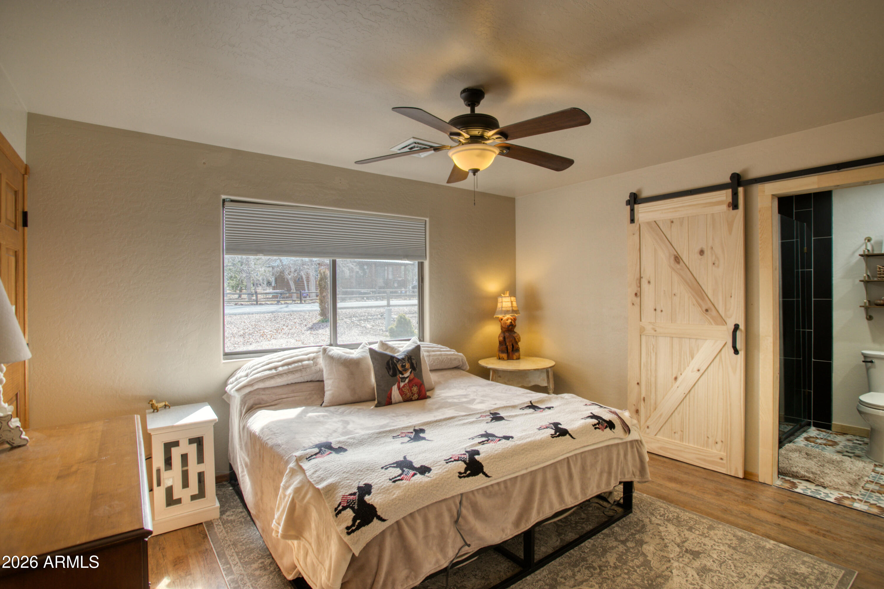 2342 South Buffalo Loop Overgaard, AZ 85933 - Photo 12 of 27 a bedroom with a bed and a window