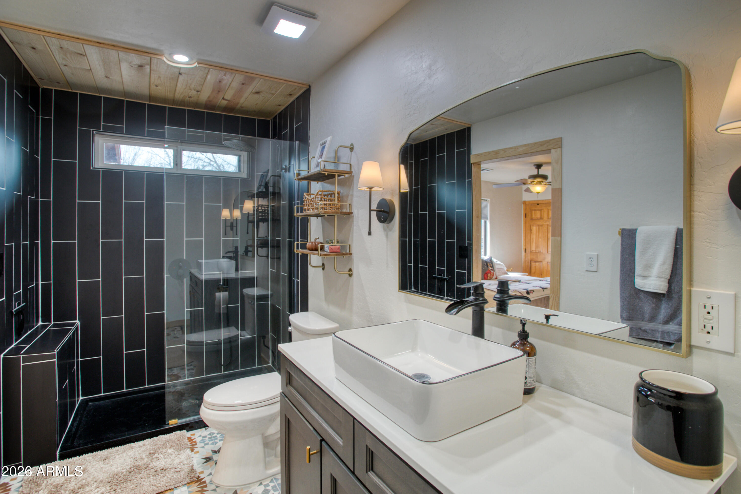 2342 South Buffalo Loop Overgaard, AZ 85933 - Photo 14 of 27 a bathroom with a sink toilet and shower