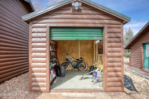 a view of a patio with table and chairs with wooden floor