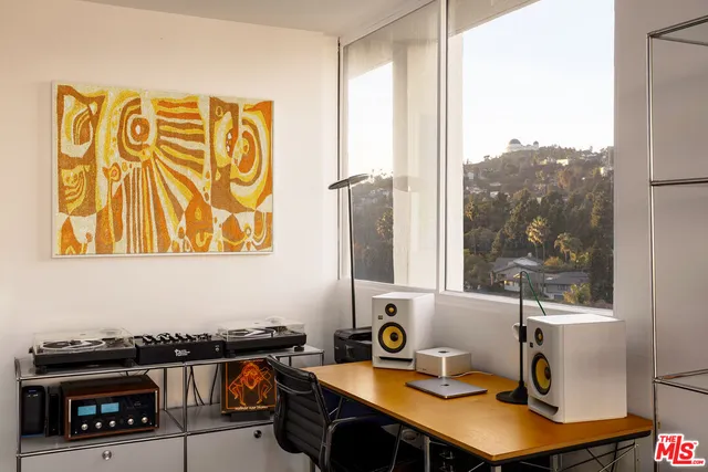 a room with a table and a fireplace