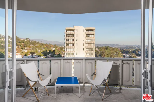 a view of a chairs and table in the terrace
