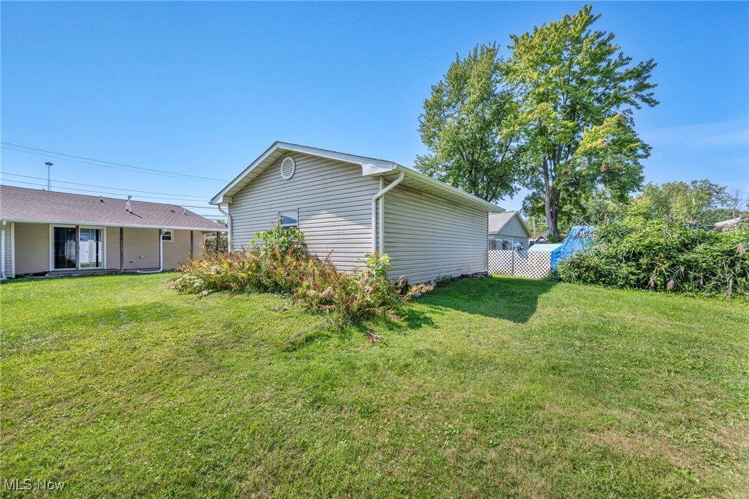39020 Center Ridge Road North Ridgeville, OH 44039 - Photo 27 of 30 View of side of property featuring a yard
