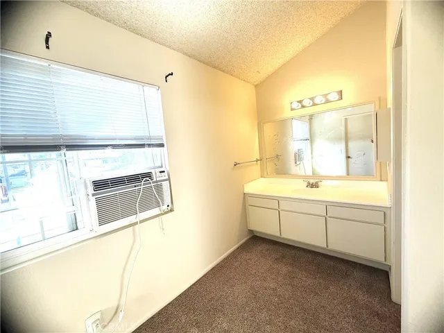 a bathroom with a toilet a sink and a shower