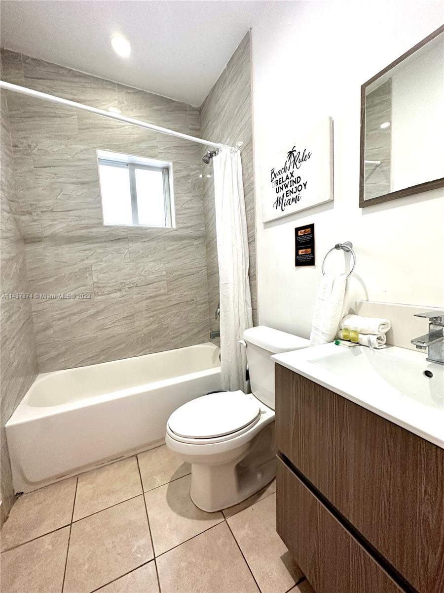 1684 Southwest 10th Street Miami, FL 33135 - Photo 8 of 15 a bathroom with a sink a toilet and bathtub