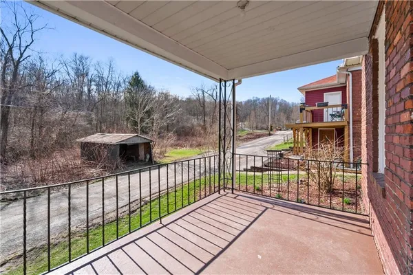 a view of a street with a balcony