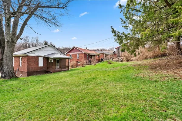 a view of a house with a big yard