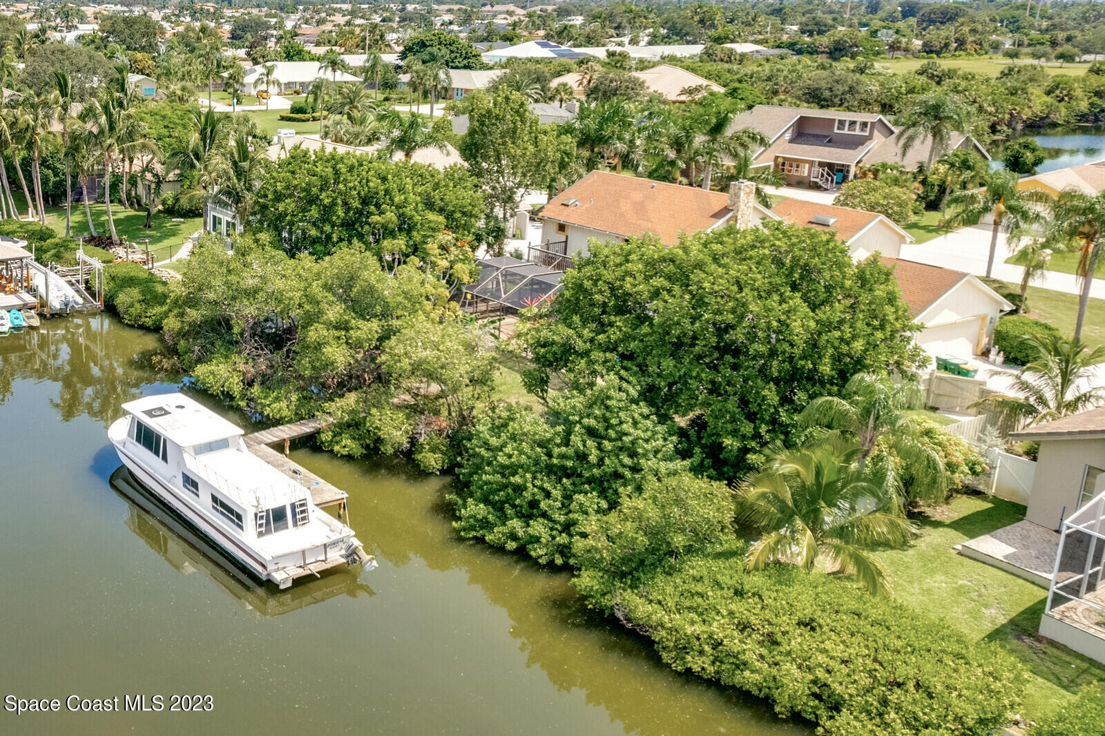 618 Tortoise Way Satellite Beach, FL 32937 - Photo 6 of 21 an aerial view of a house with a yard swimming pool and lake view