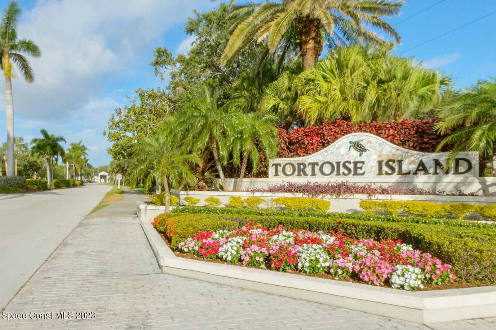 618 Tortoise Way Satellite Beach, FL 32937 - Photo 10 of 21 a view of a sign board with flower plants