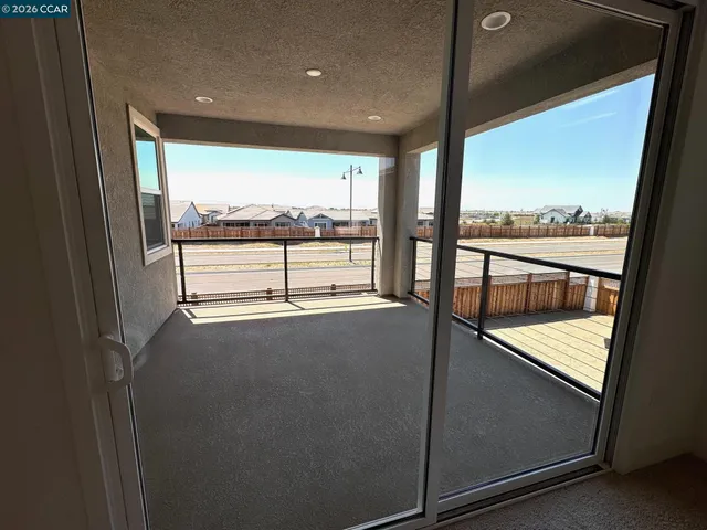 a view of a glass door with a balcony