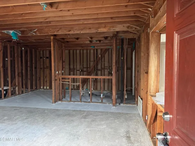 a view of an empty room with glass door