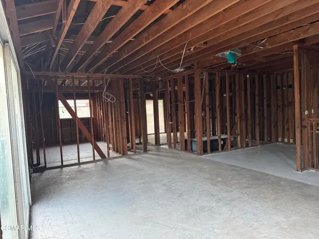 a view of an empty room with stairs