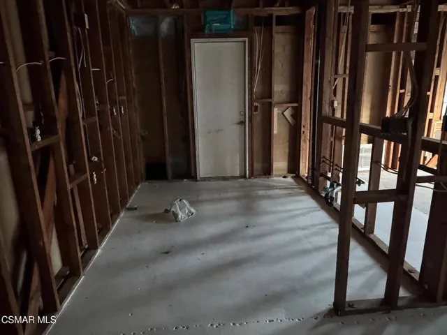 a view of an empty room with stairs