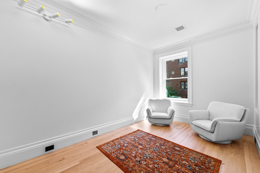 320 Tappan Street, Unit 1 Brookline, MA 02445 - Photo 8 of 10 a living room with furniture and a rug