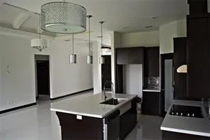 a kitchen with stainless steel appliances granite countertop a stove and a refrigerator